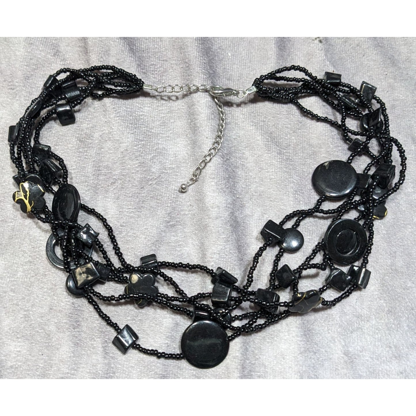 Multistrand Black Beaded Artisan Necklace With Geometric Stone Accents