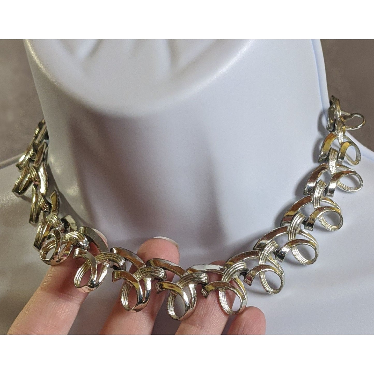 Vintage Ribbon Swirl Silver-Tone Statement Necklace With Elegant Interwoven Loops Design