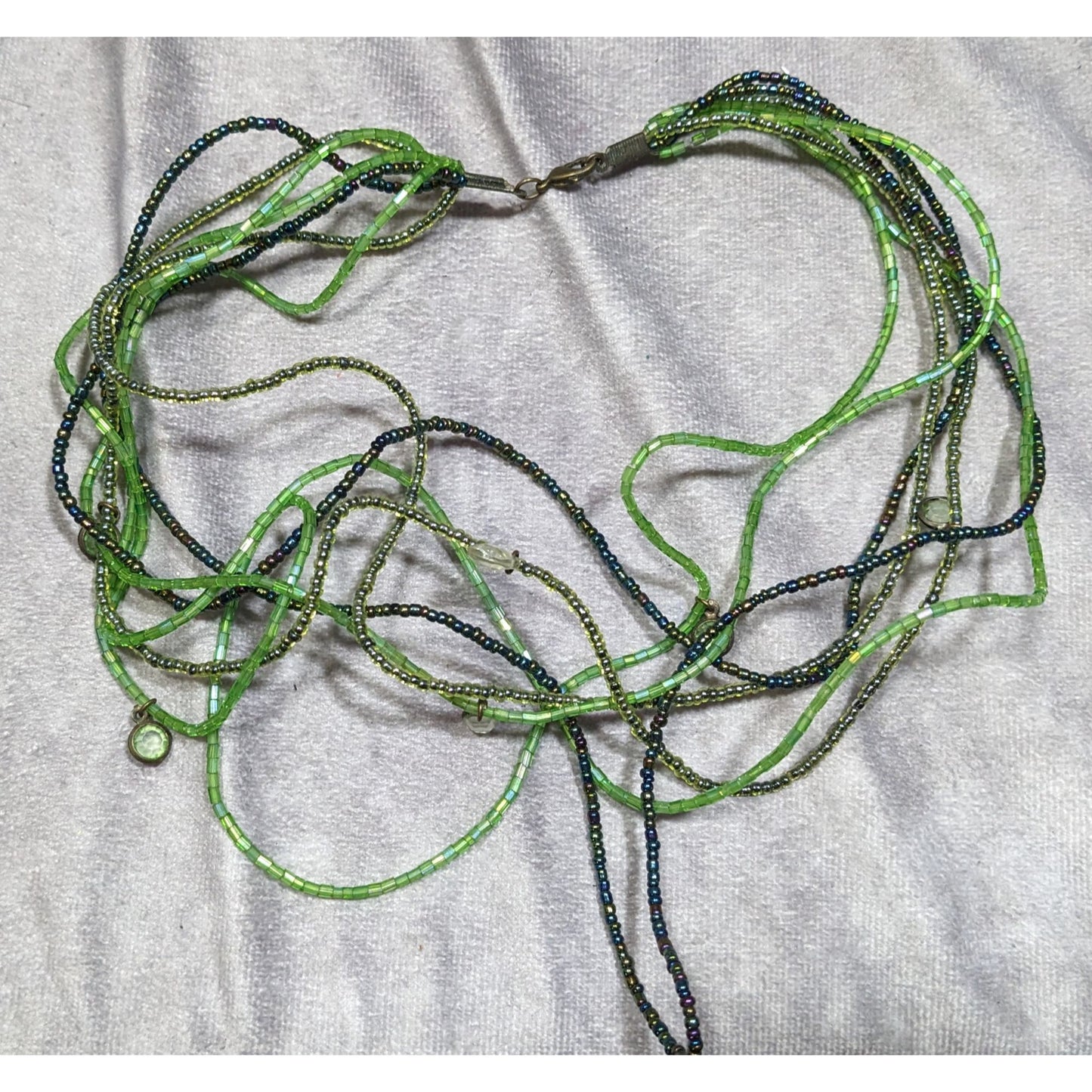 Wiggly Fantasy Green Glass Beaded Layered Necklace With Small Charms & Lobster Clasp Closure