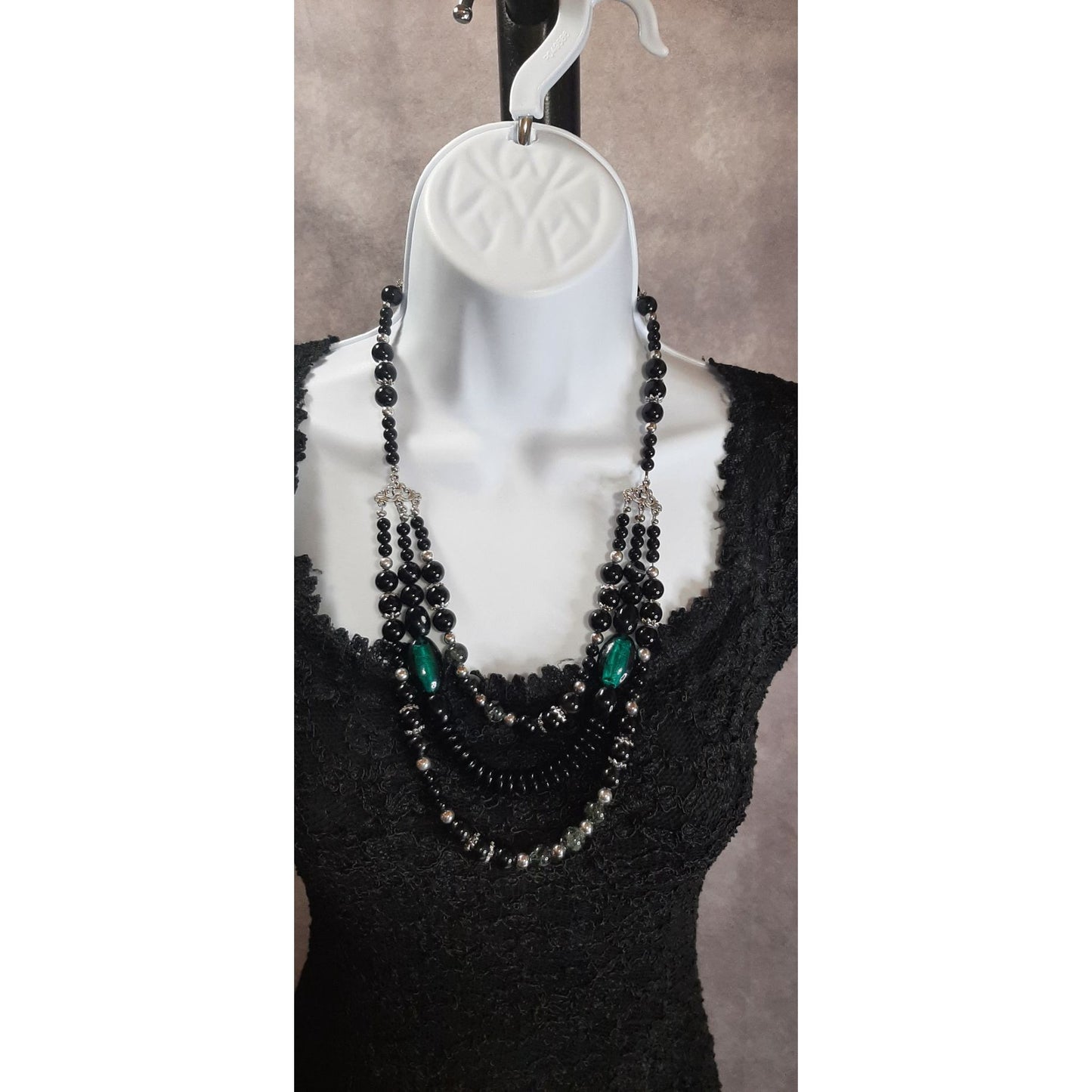 Multi-Strand Black Beaded Necklace With Green Accents & Silver Tone Details
