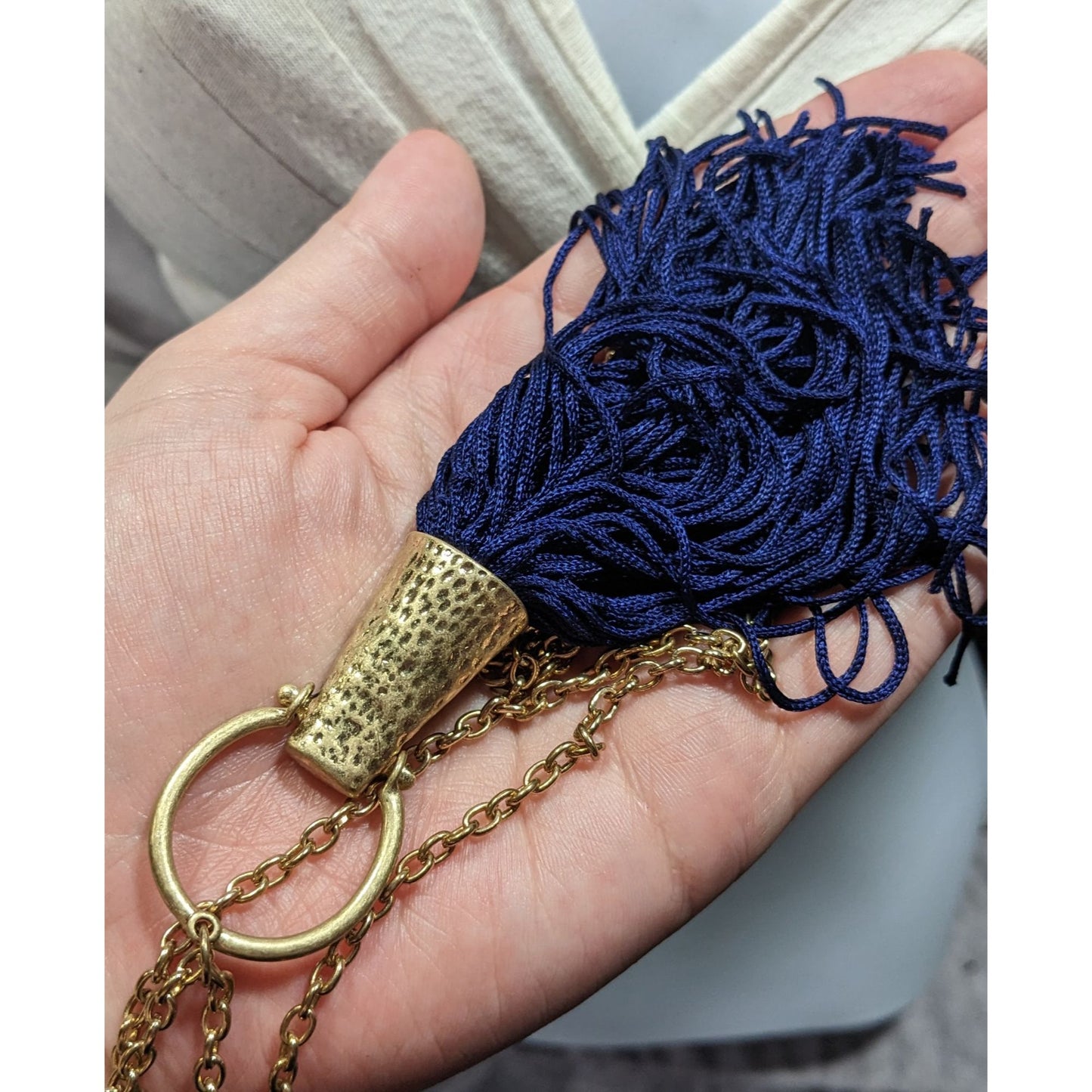 Hammered Gold Tone Tassel Pendant Necklace With Blue Tassel