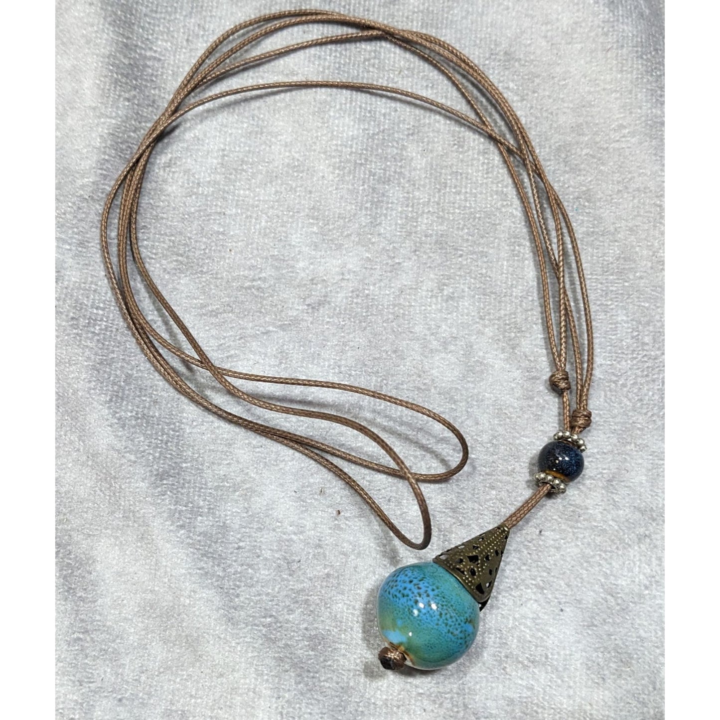 Bohemian Fantasy Blue Ceramic Pendant Necklace On Brown Cord