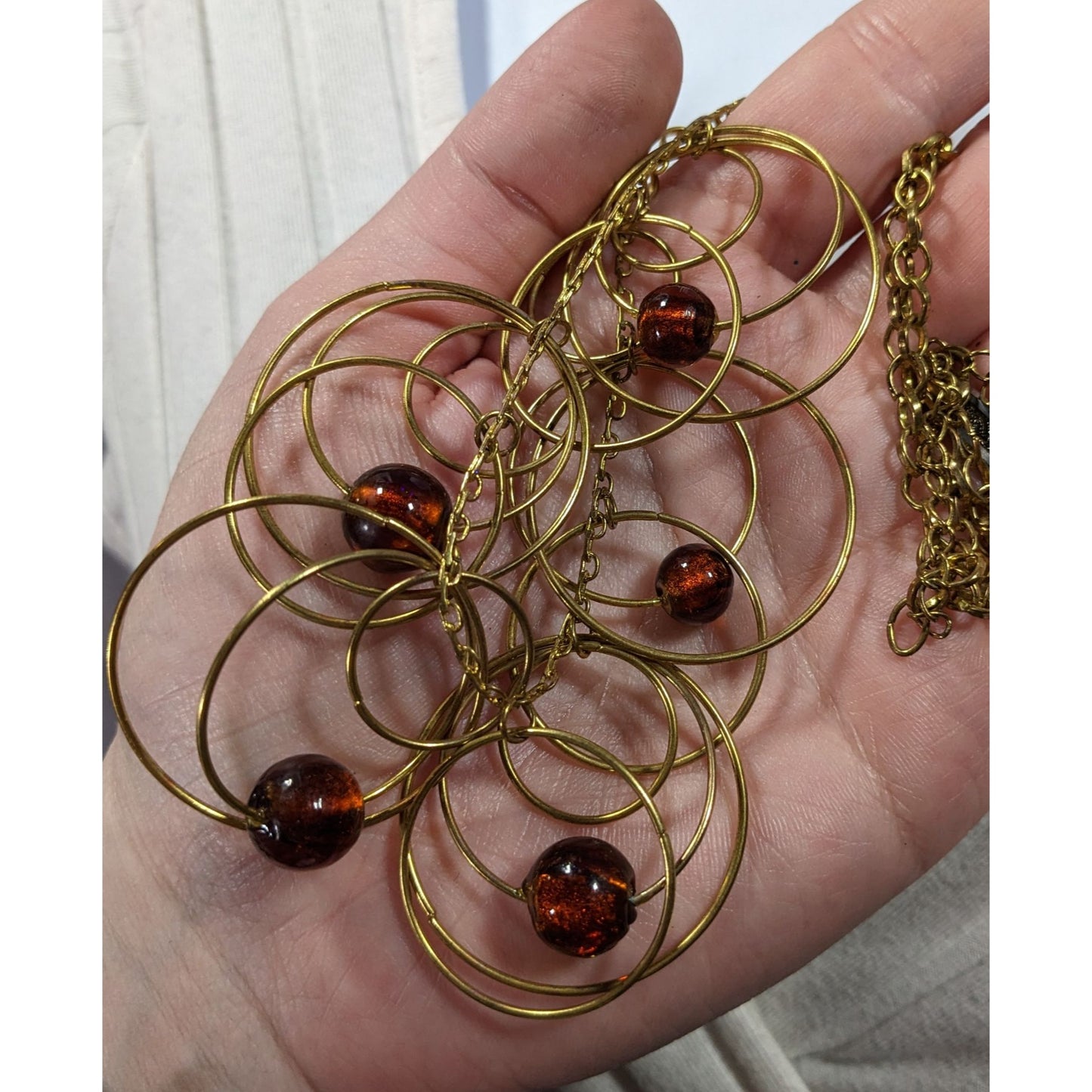 Modern Gold Tone Loop Necklace With Brown Beaded Accents