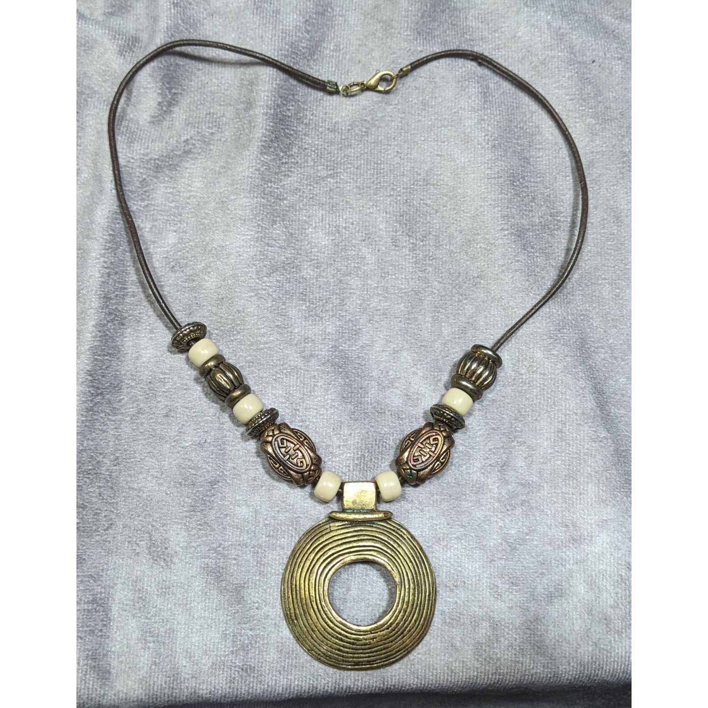 Vintage Brutalist Gold Tone And White Beaded Medallion Pendant Necklace