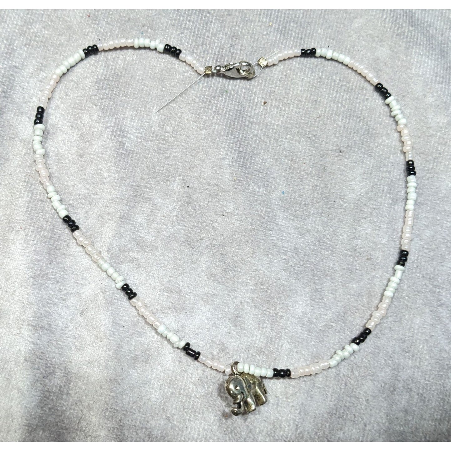 90s Bohemian Black And White Glass Beaded Necklace With Silver Tone Elephant Charm