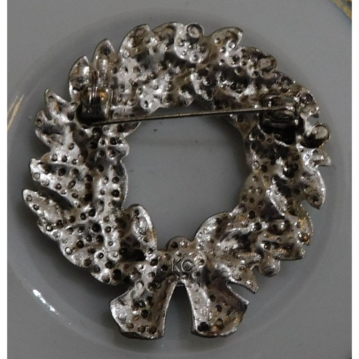 Vintage Kenneth Cole Wreath Brooch With Red Rhinestones