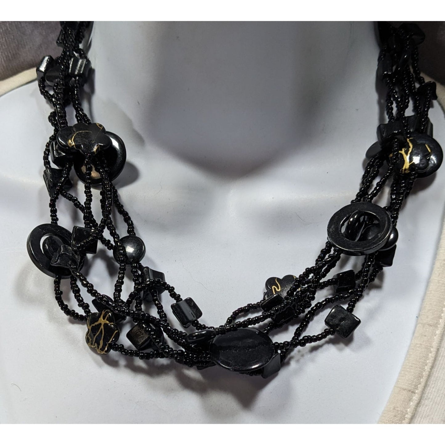 Multistrand Black Beaded Artisan Necklace With Geometric Stone Accents