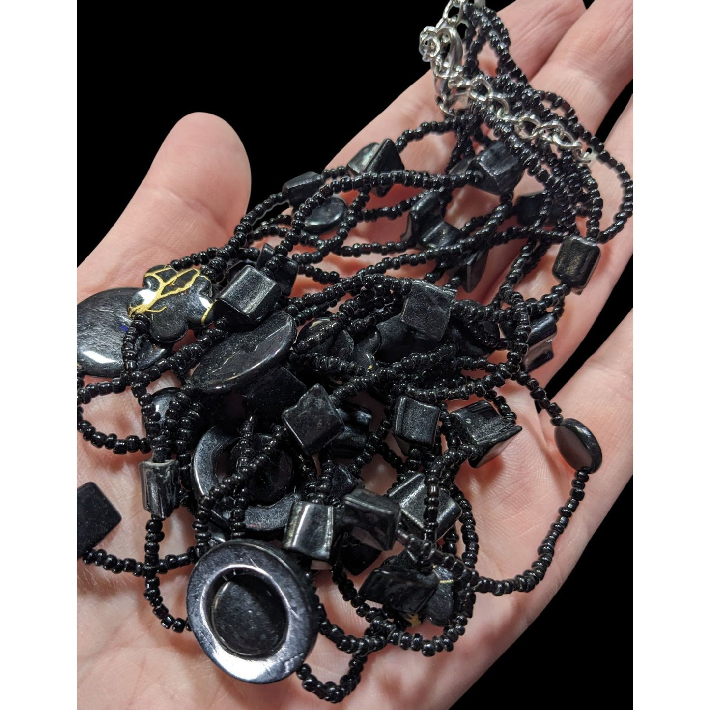 Multistrand Black Beaded Artisan Necklace With Geometric Stone Accents