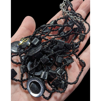 Multistrand Black Beaded Artisan Necklace With Geometric Stone Accents