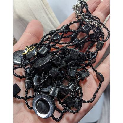 Multistrand Black Beaded Artisan Necklace With Geometric Stone Accents