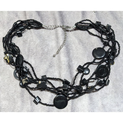 Multistrand Black Beaded Artisan Necklace With Geometric Stone Accents