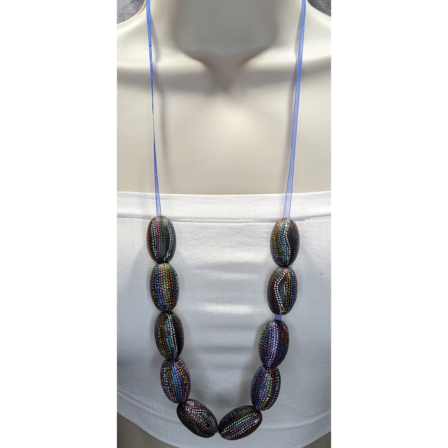 Handmade Nature Themed Necklace With Rainbow Painted Seeds & Blue Ribbon
