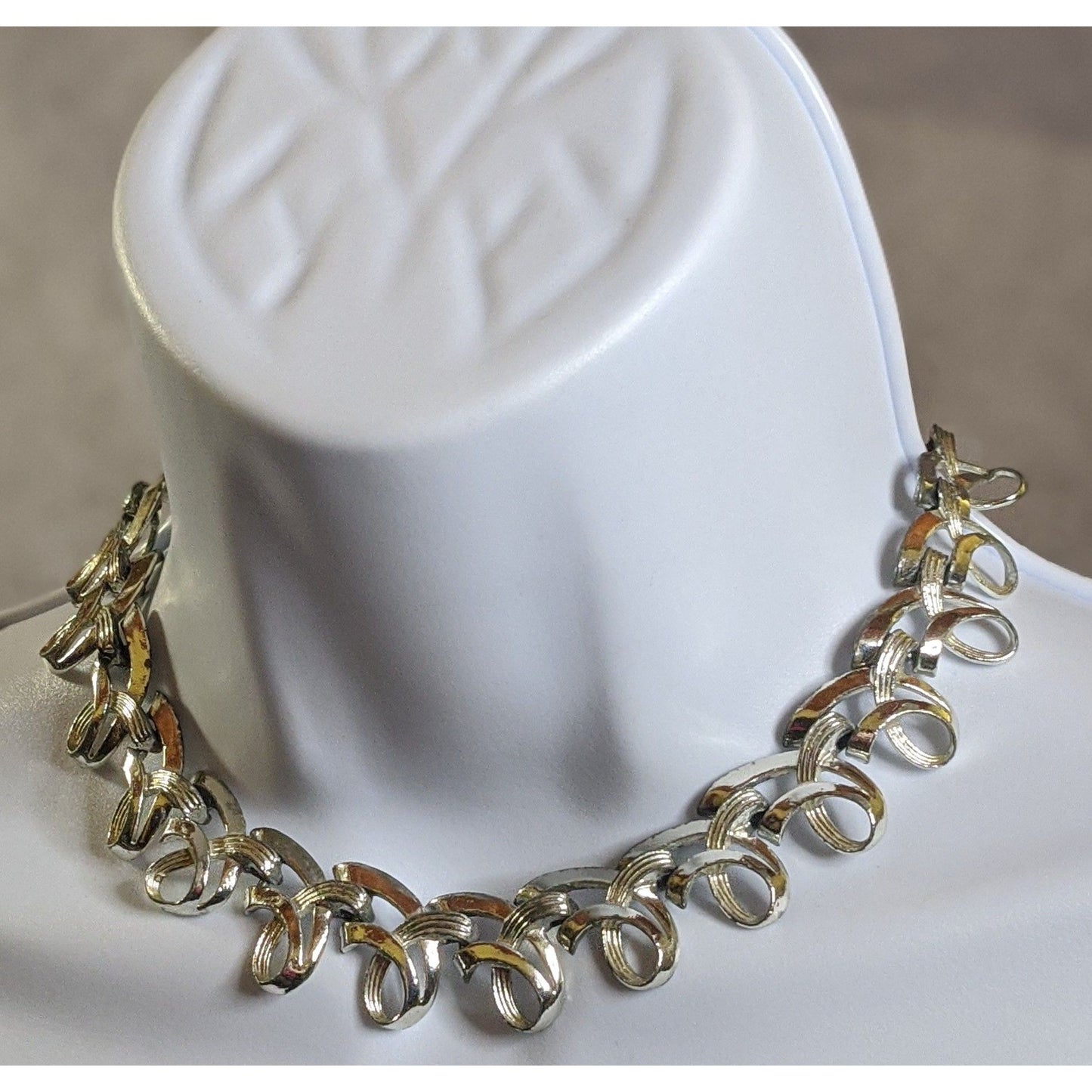 Vintage Ribbon Swirl Silver-Tone Statement Necklace With Elegant Interwoven Loops Design