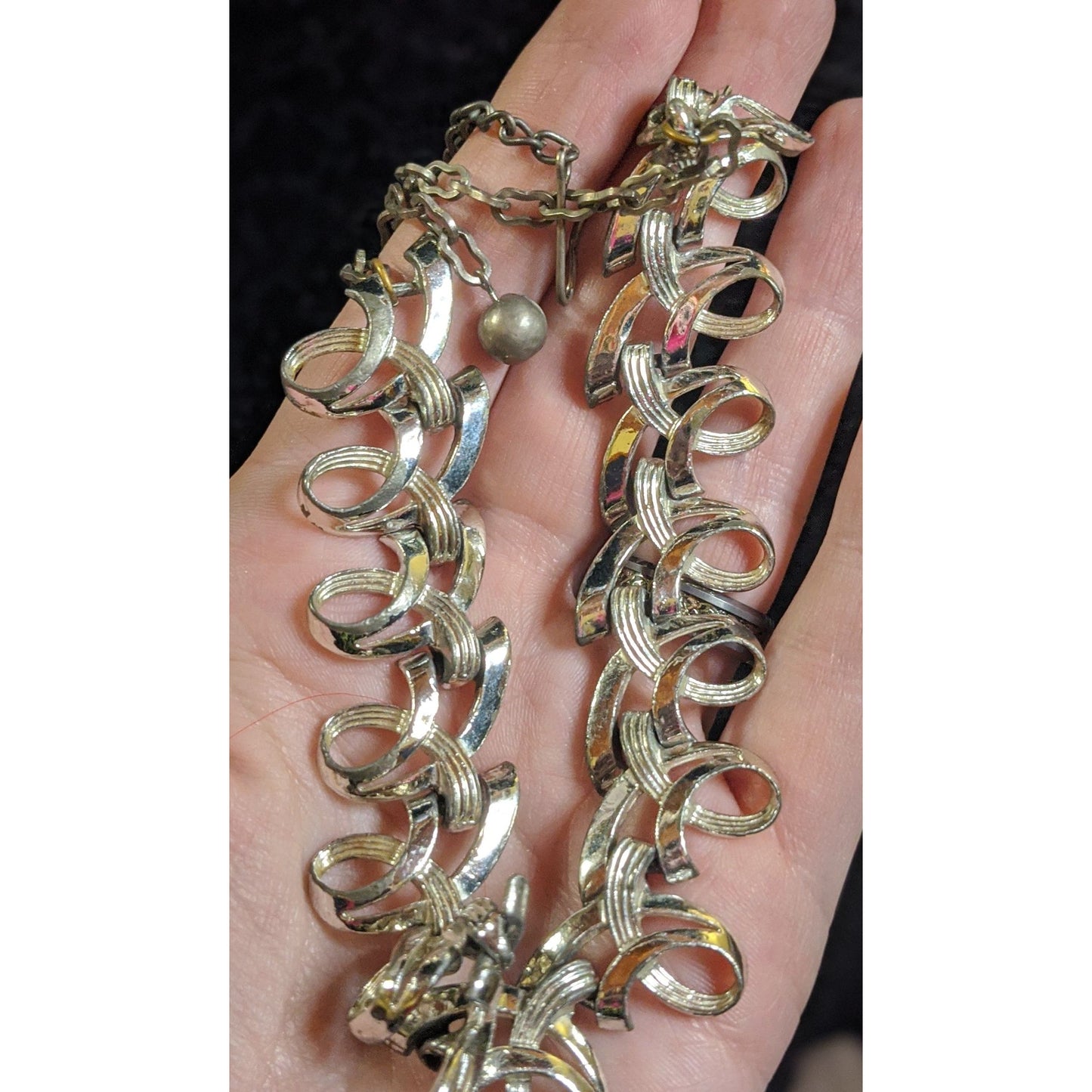 Vintage Ribbon Swirl Silver-Tone Statement Necklace With Elegant Interwoven Loops Design