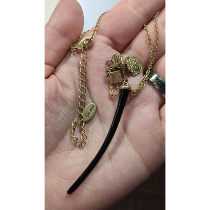 Guess Abstract Claw And Charm Black And Gold Tone Necklace