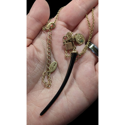 Guess Abstract Claw And Charm Black And Gold Tone Necklace