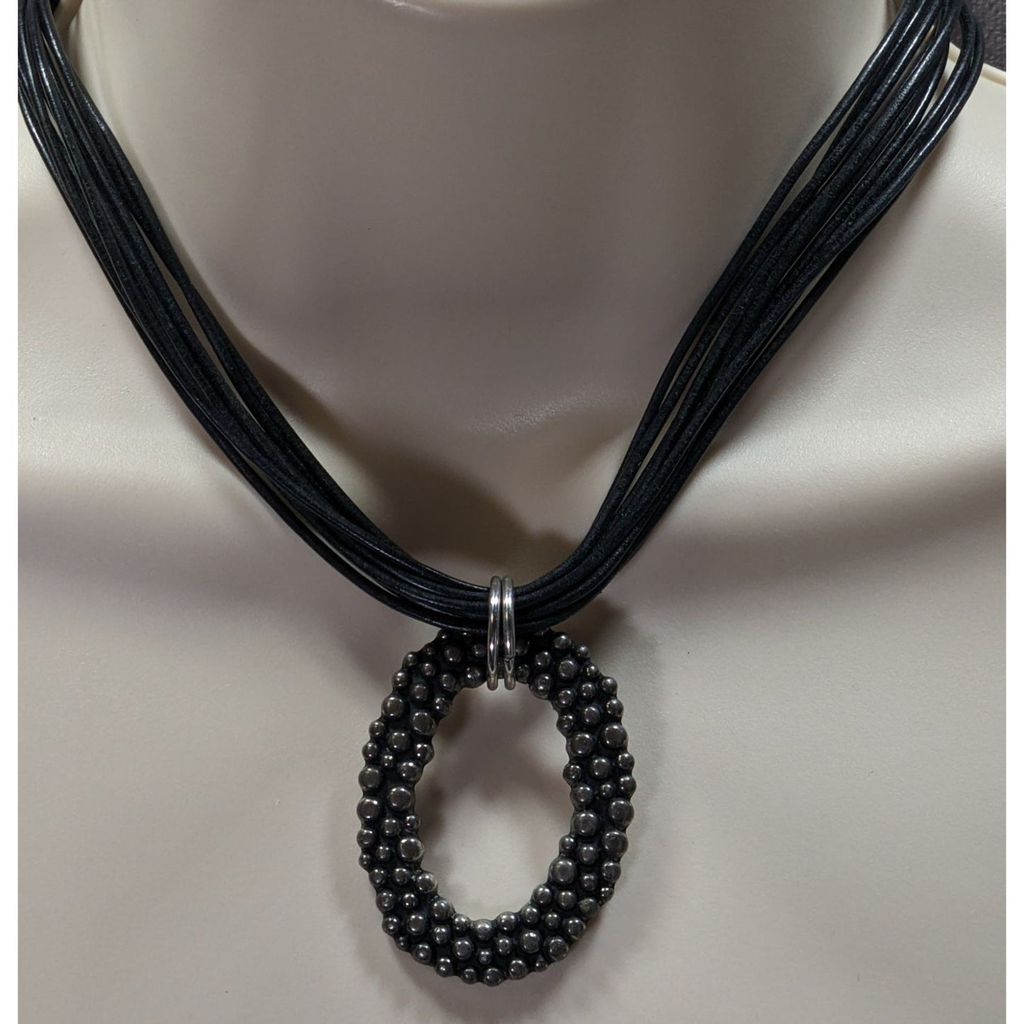 Bohemian Black Multi-Strand Necklace With Bubble Textured Oval Pendant