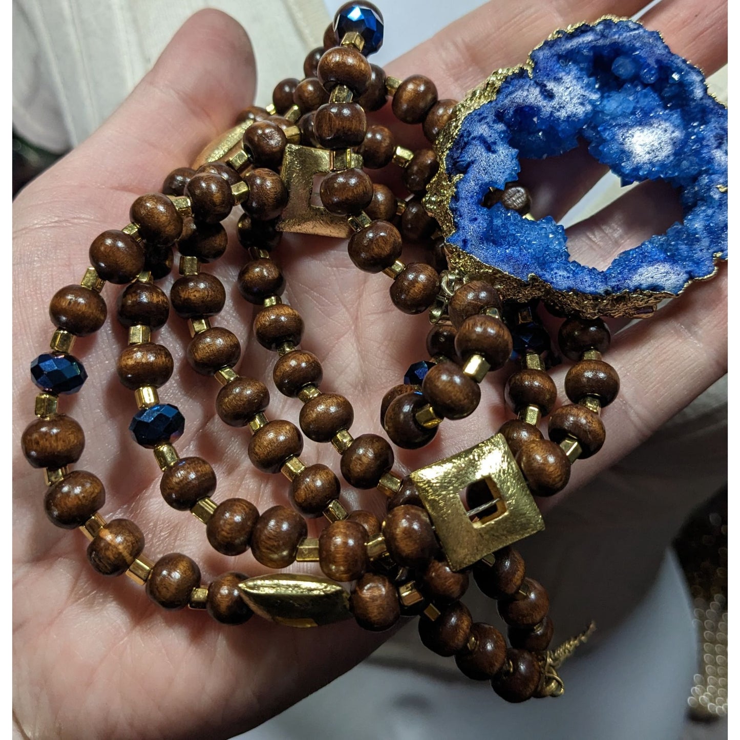 Blue Faux Geode Slice Pendant Necklace With Brown Wood And Gold Tone Metal Beads