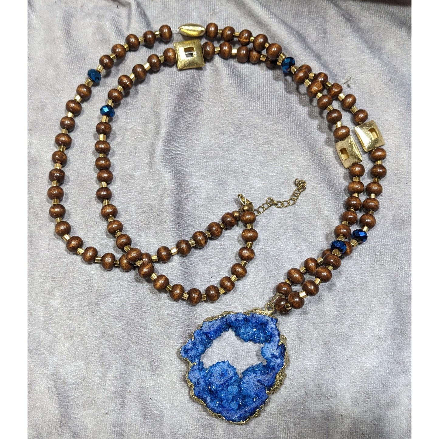 Blue Faux Geode Slice Pendant Necklace With Brown Wood And Gold Tone Metal Beads