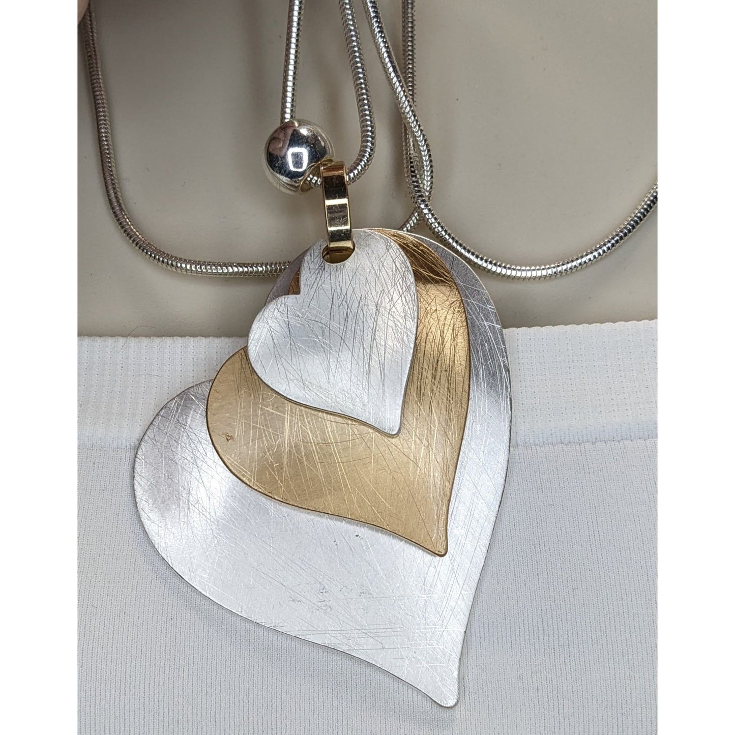 Brutalist Coquette Love Themed Silver & Gold-Tone Layered Heart Pendant Necklace With Snake Chain