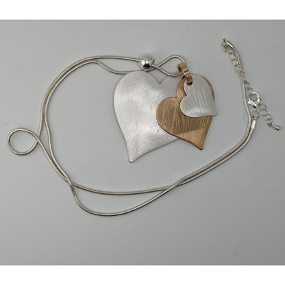 Brutalist Coquette Love Themed Silver & Gold-Tone Layered Heart Pendant Necklace With Snake Chain