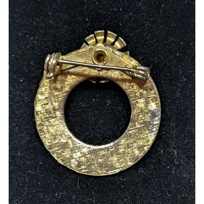 Vintage Elegant Textured Gold Tone Open Circle Brooch With Red Rhinestone