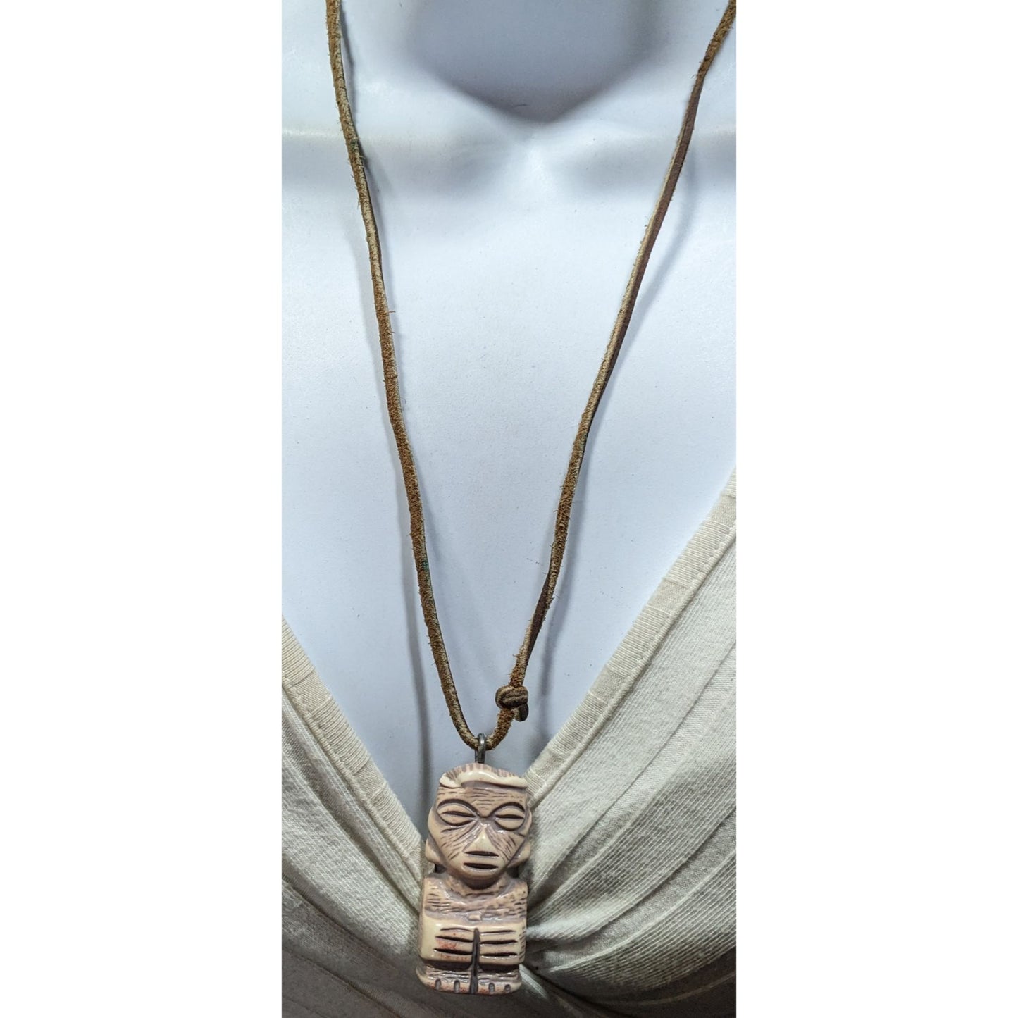 Tribal Pendant Necklace With Unique Figure Carving On Brown Suede Cord