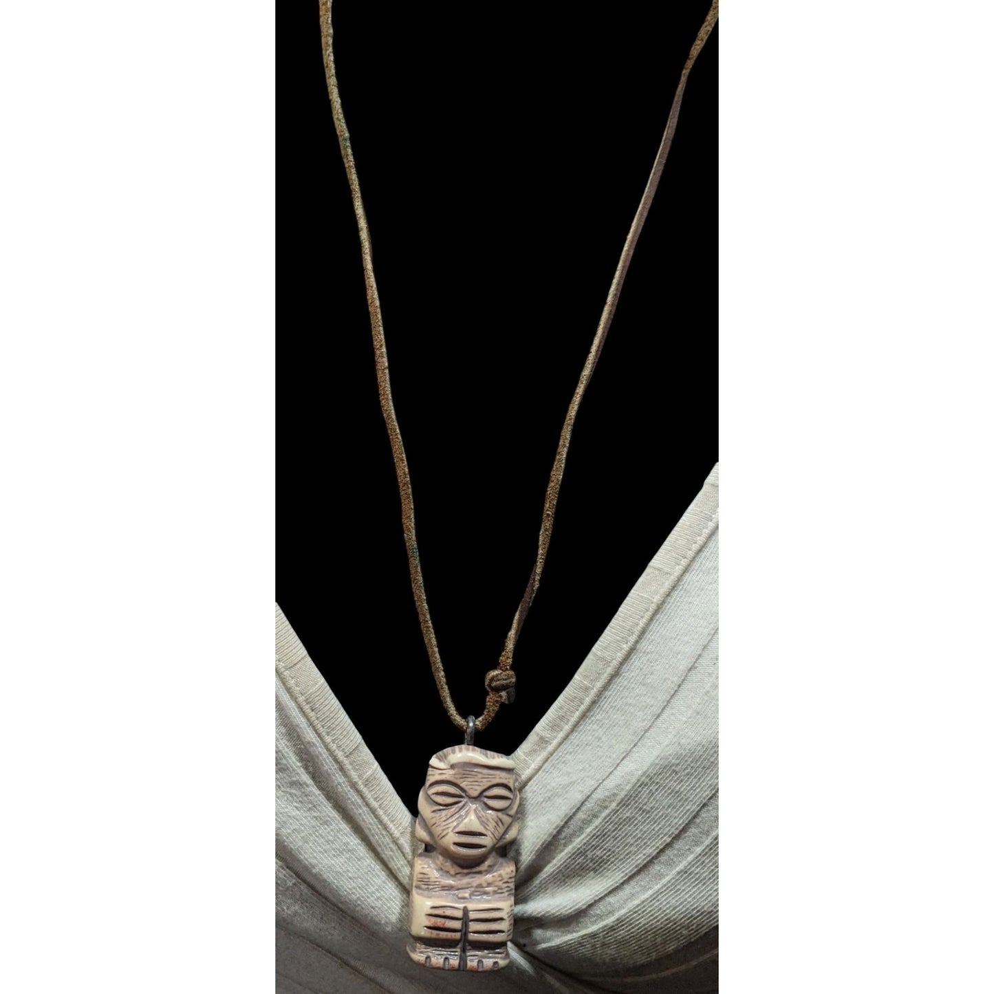 Tribal Pendant Necklace With Unique Figure Carving On Brown Suede Cord