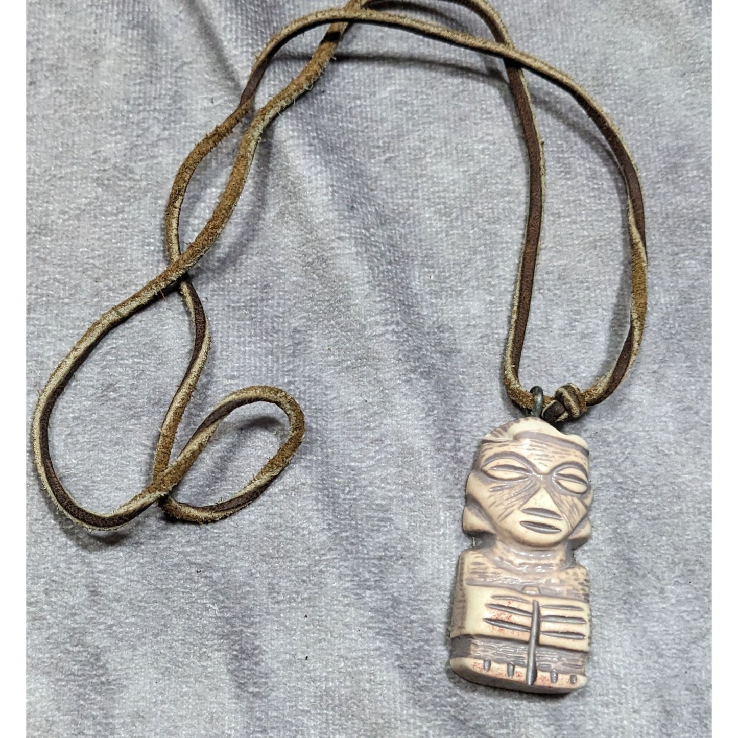 Tribal Pendant Necklace With Unique Figure Carving On Brown Suede Cord