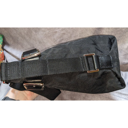 DKNY Black Canvas Shoulder Bag With Buckle Accents & Zip Closure