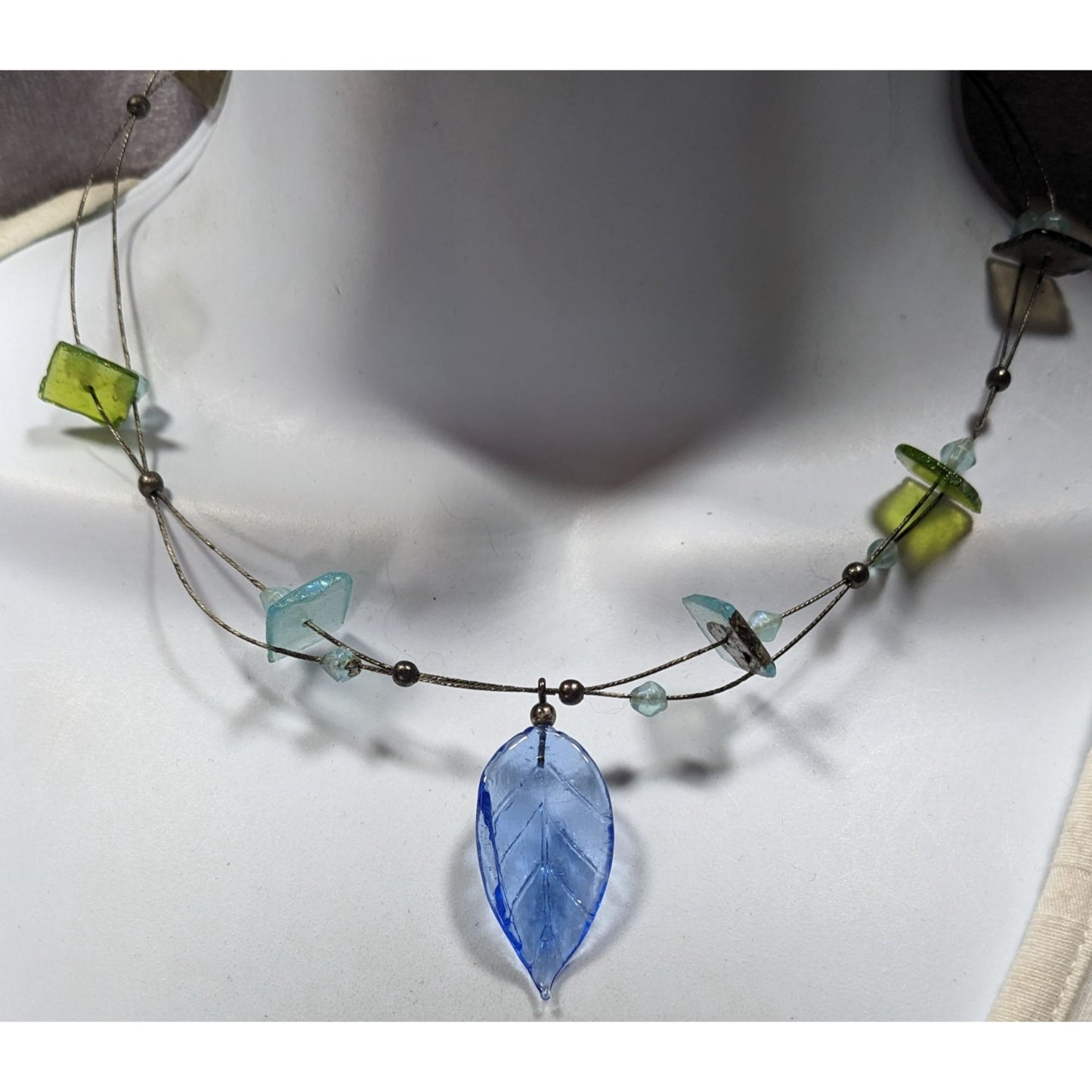 Handcrafted Necklace With Blue Glass Leaf Pendant & Green Accent Beads On Silver Wire Chain