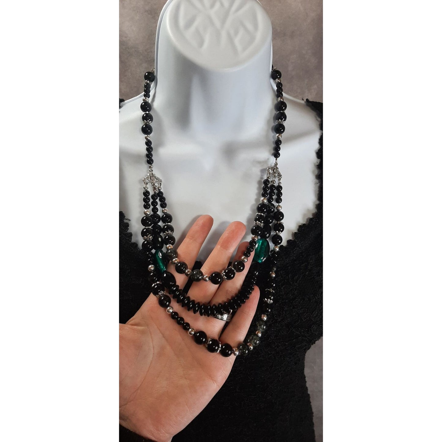 Multi-Strand Black Beaded Necklace With Green Accents & Silver Tone Details