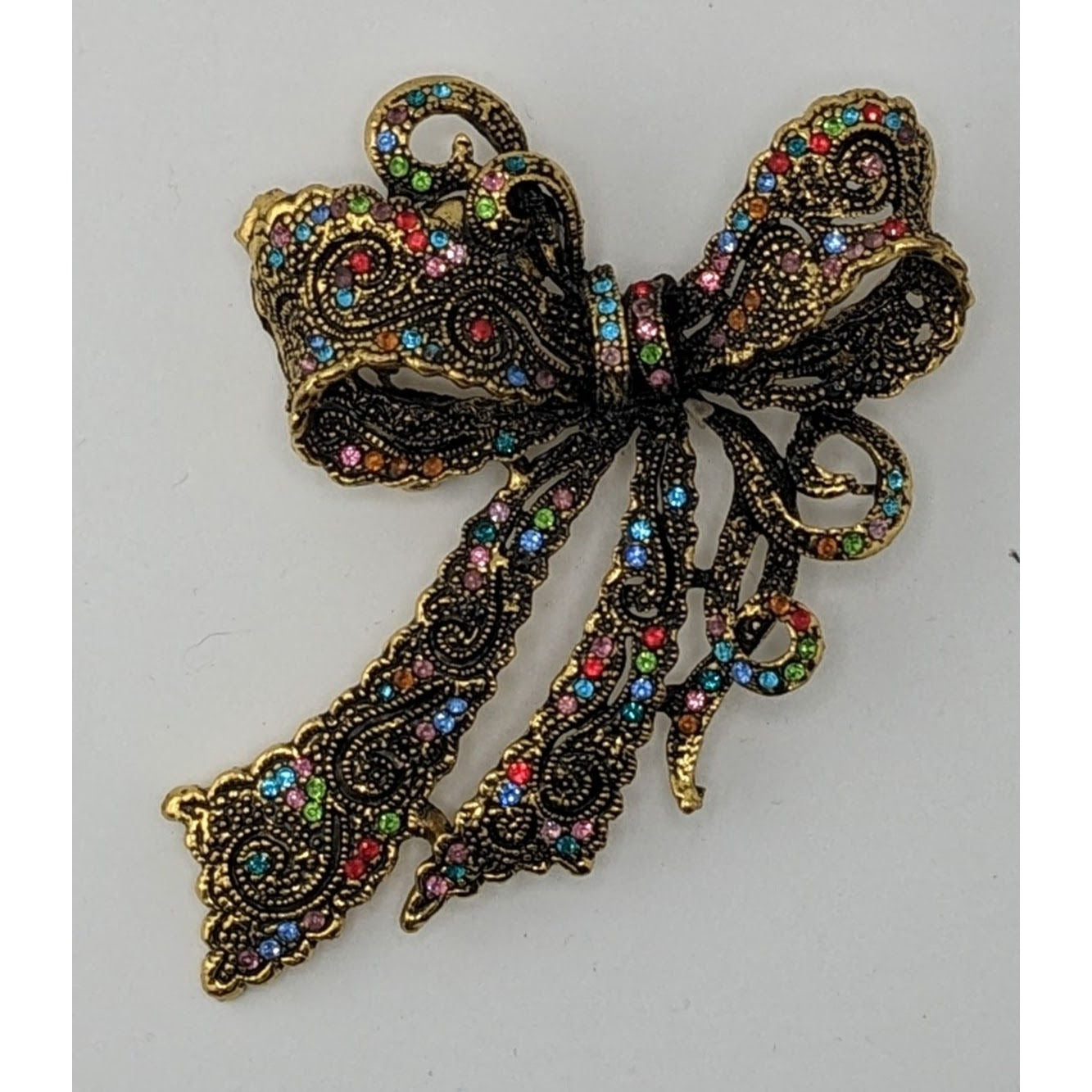 Coquette Fantasy Rainbow Rhinestone Bow Brooch With Gold Tone Metal