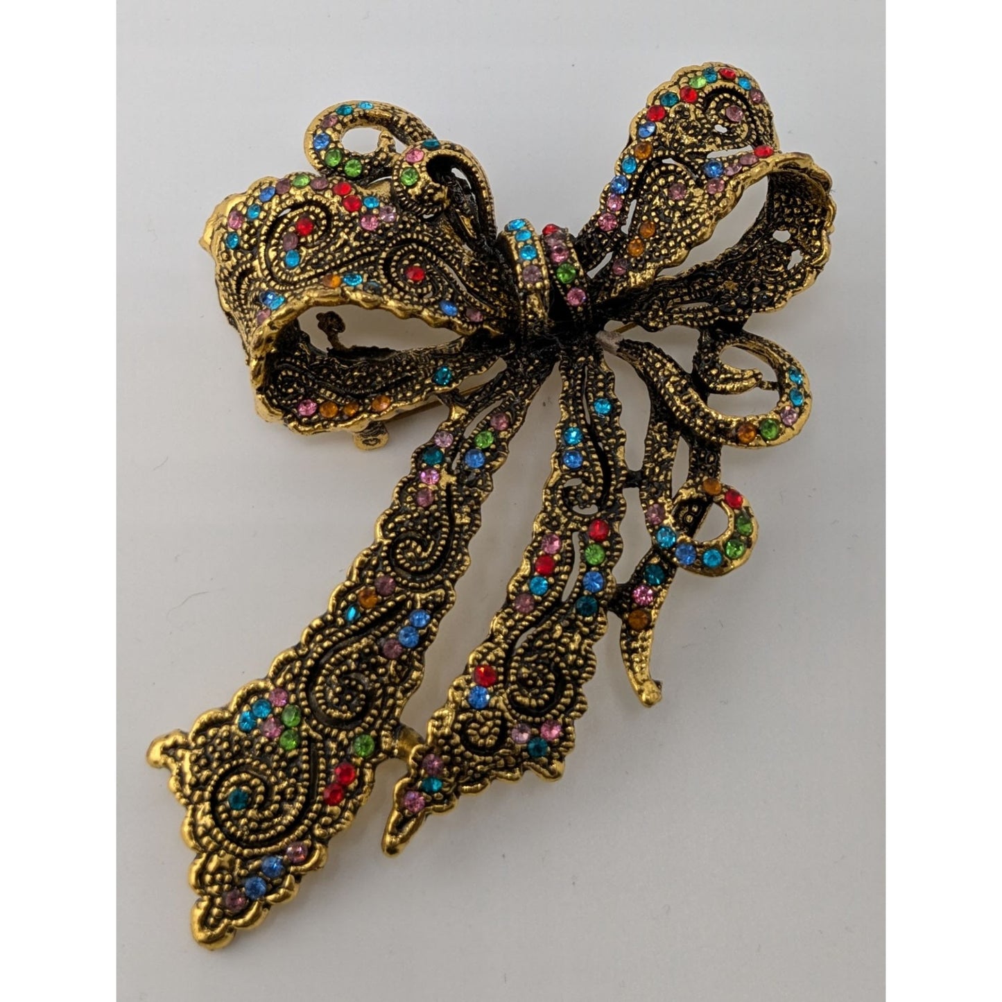 Coquette Fantasy Rainbow Rhinestone Bow Brooch With Gold Tone Metal
