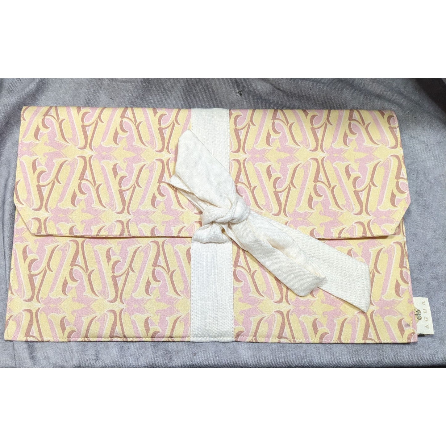 Agua by Agua Bendita Pink And Yellow Monogram Canvas Clutch