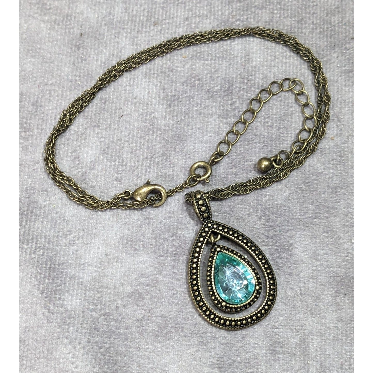 Whimsical Teardrop Blue Gemmed Gold Tone Pendant Necklace