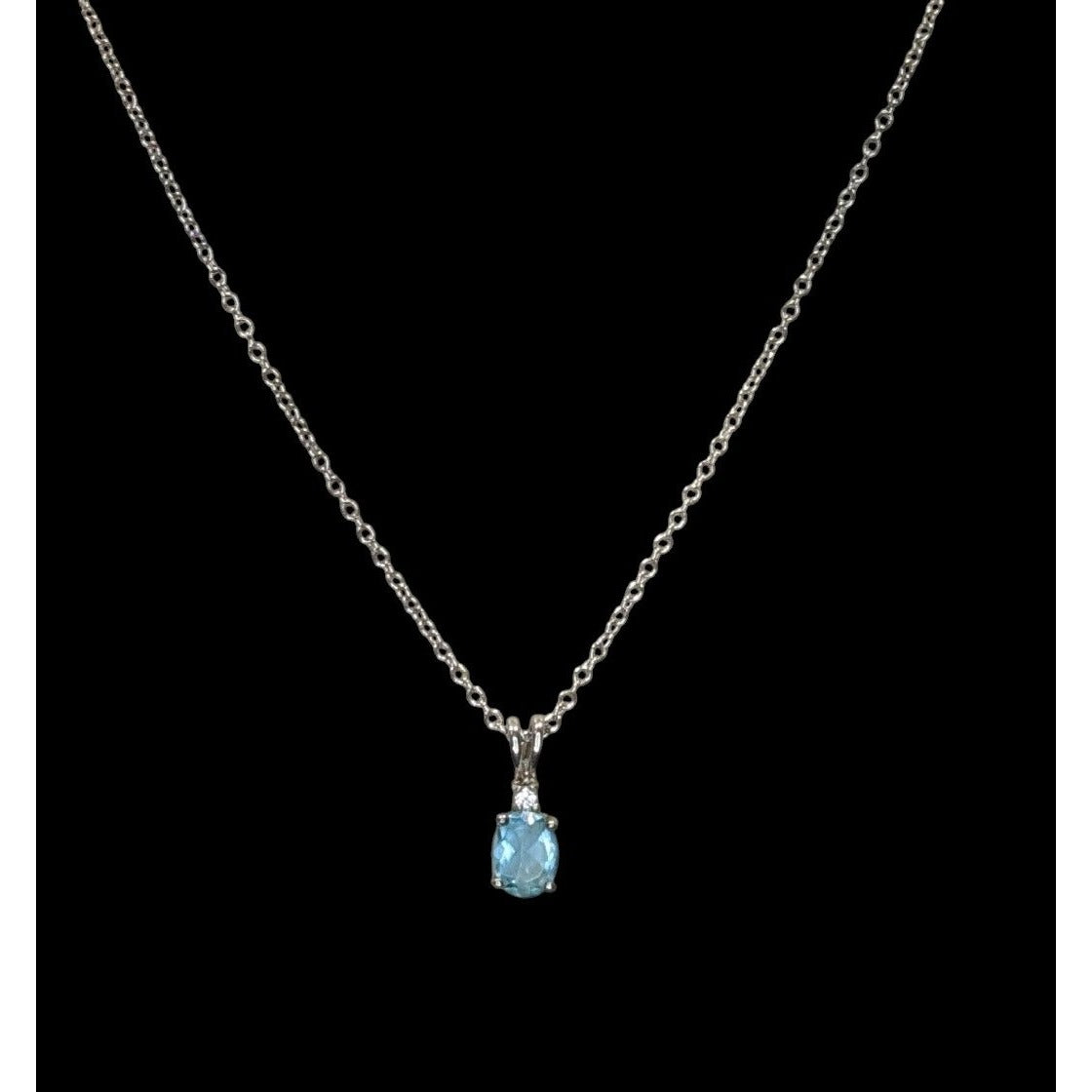 Elegant Silver Tone Necklace With Blue Topaz Oval Pendant And Clear Stone Accent
