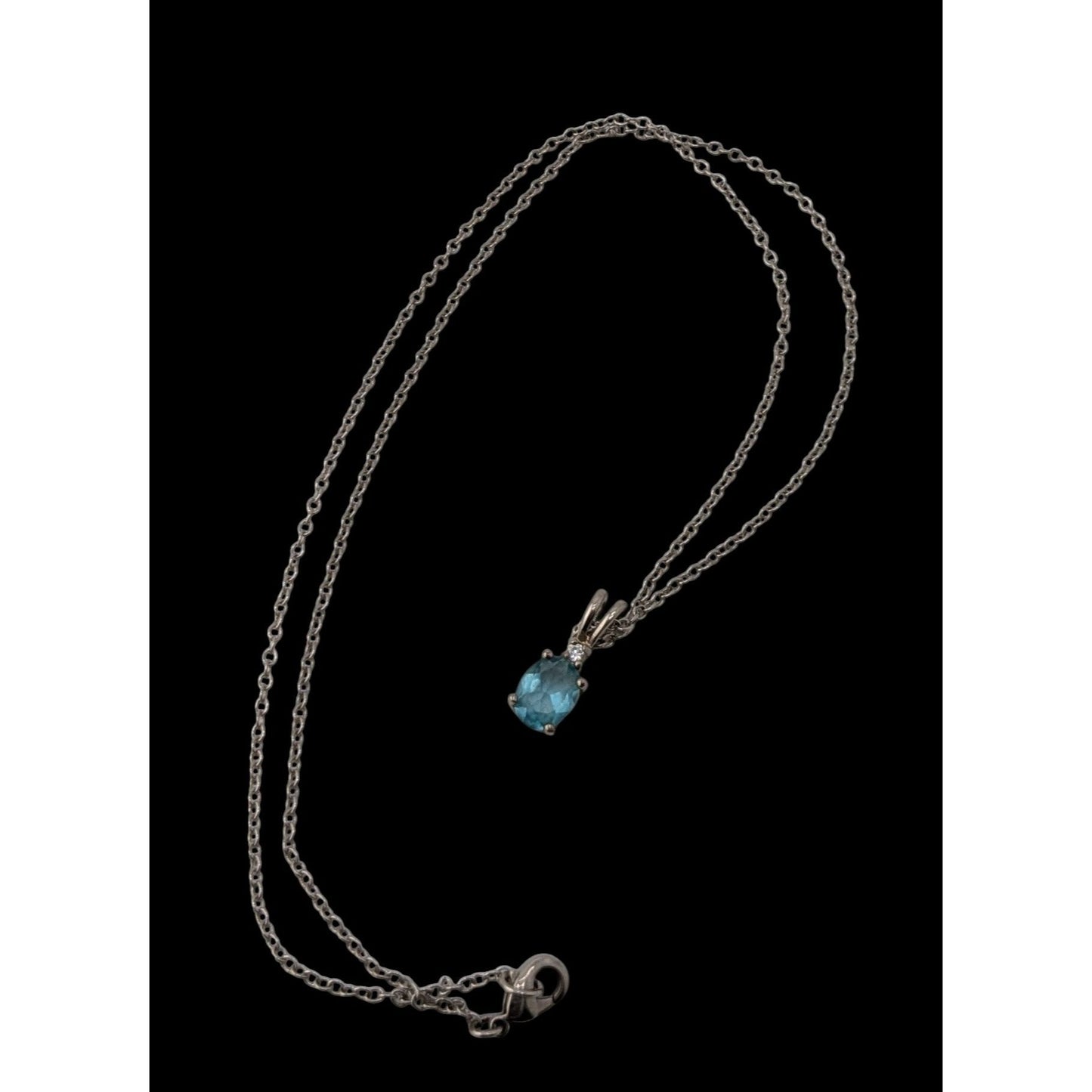 Elegant Silver Tone Necklace With Blue Topaz Oval Pendant And Clear Stone Accent