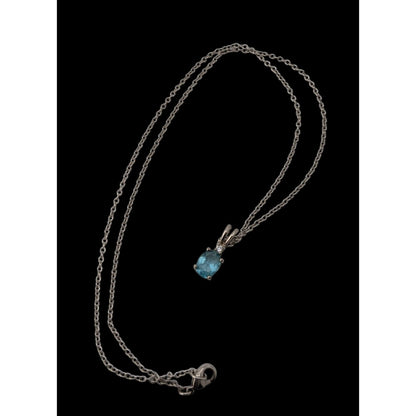 Elegant Silver Tone Necklace With Blue Topaz Oval Pendant And Clear Stone Accent