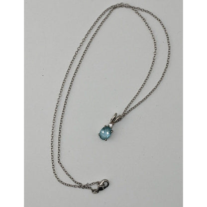 Elegant Silver Tone Necklace With Blue Topaz Oval Pendant And Clear Stone Accent
