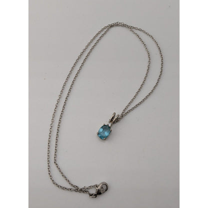 Elegant Silver Tone Necklace With Blue Topaz Oval Pendant And Clear Stone Accent
