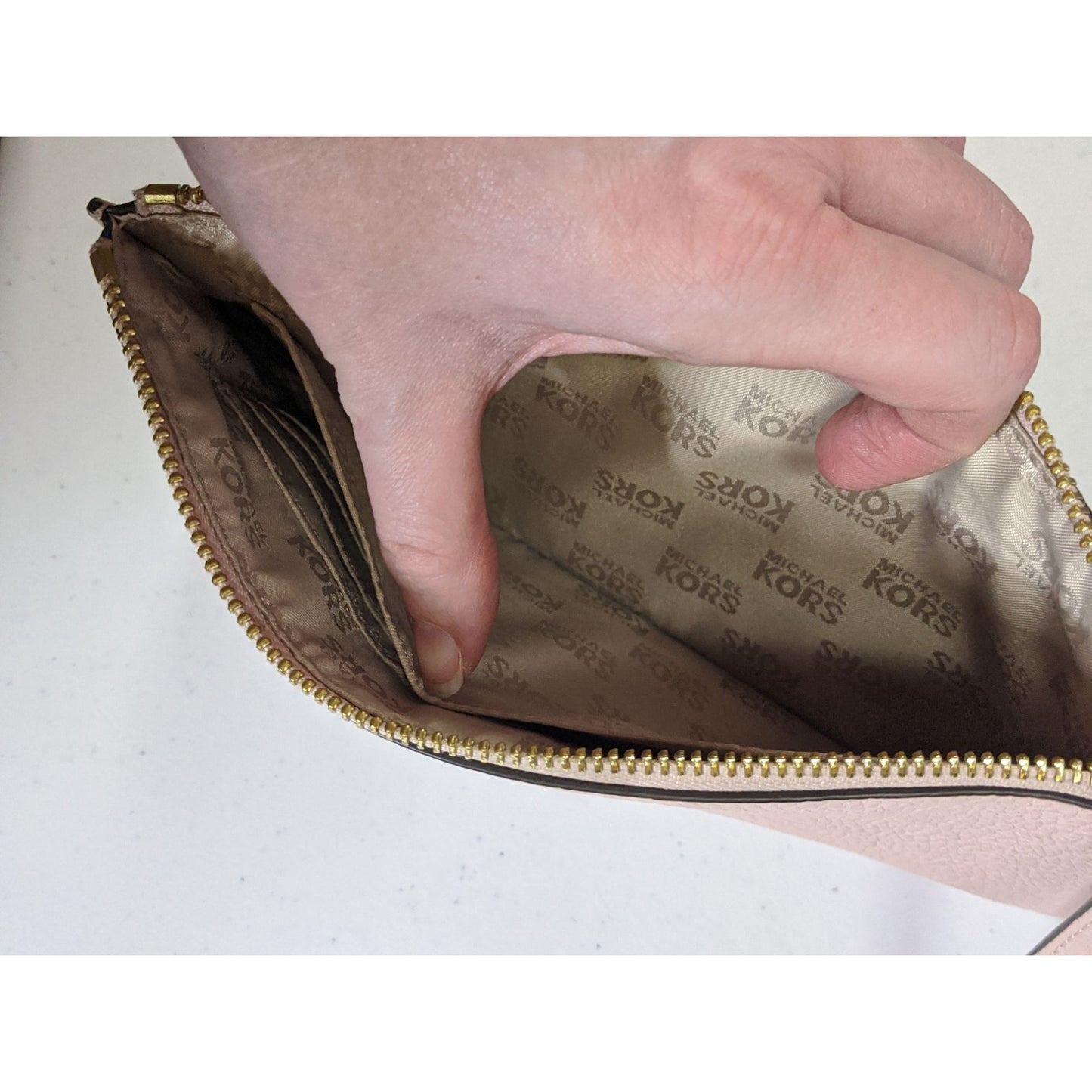 Michael Kors Dusty Rose Pebbled Leather Wristlet 5.5x10 Inches With 6.5-Inch Strap & Gold-Tone Zipper Closure