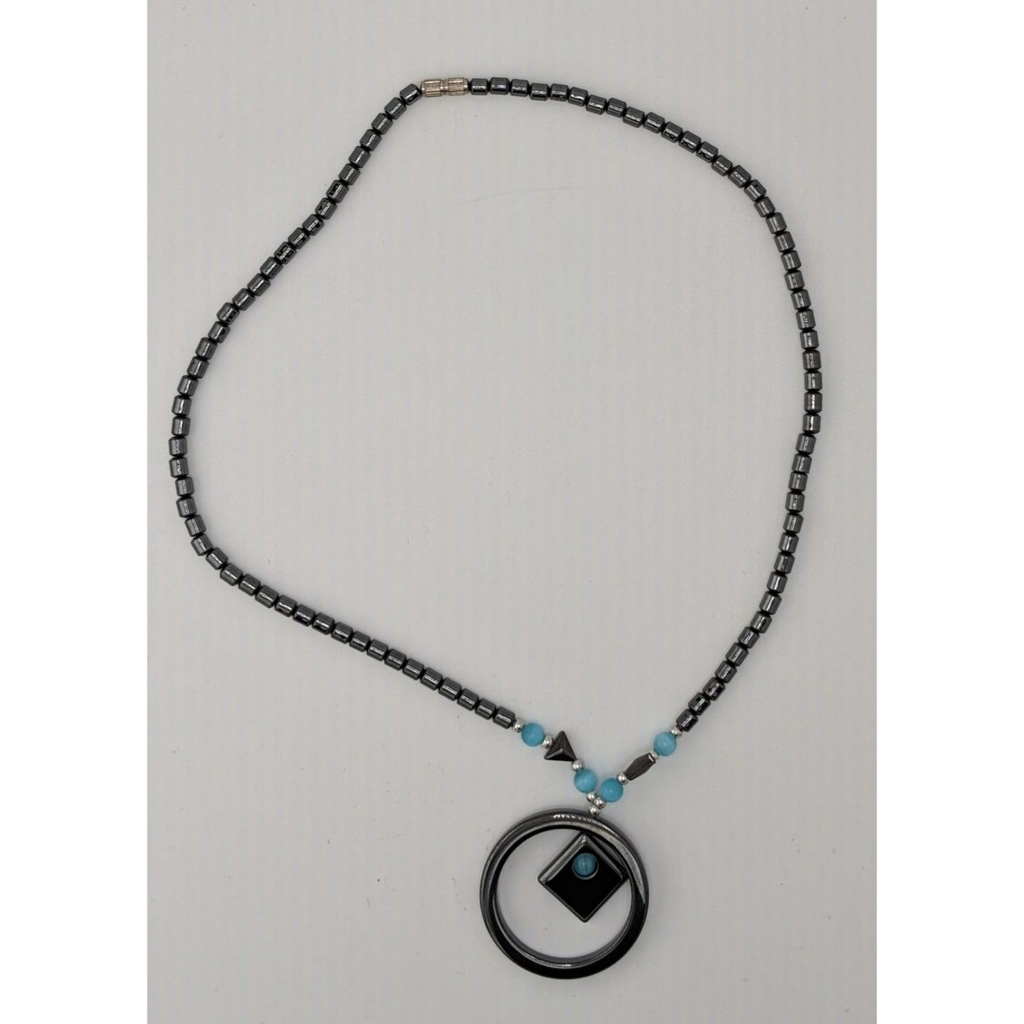 Hematite Geometric Beaded Pendant Necklace With Blue Cateye Glass Accents