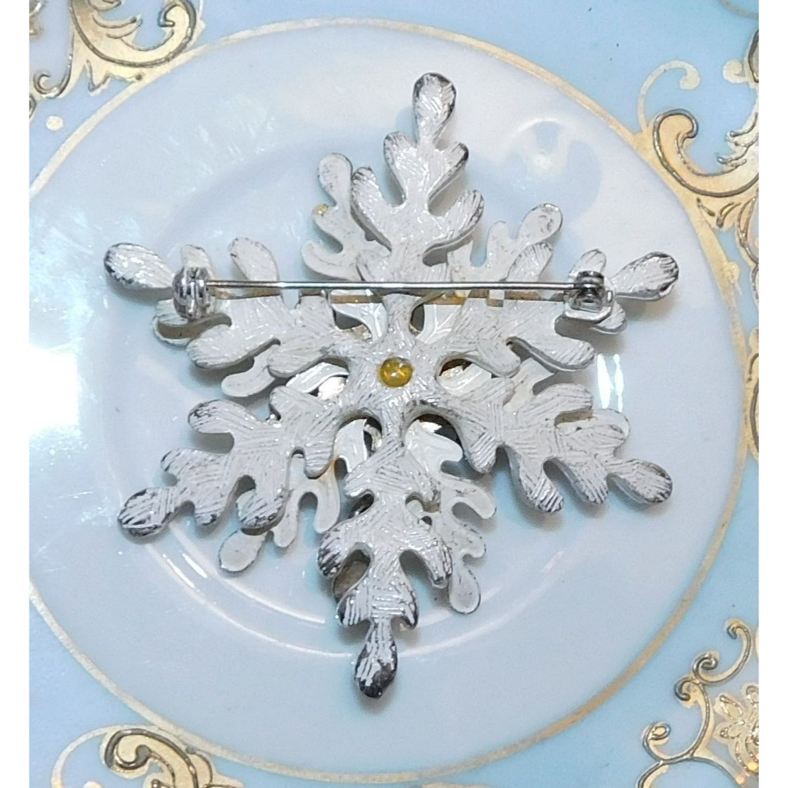 Vintage White Snowflake Brooch With Silver Tone And Blue Accents