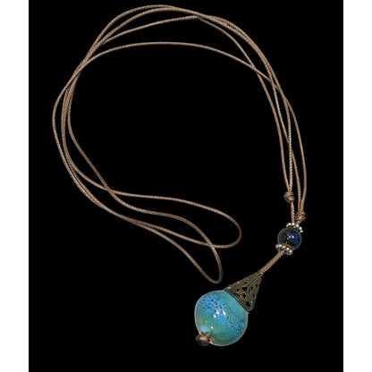 Bohemian Fantasy Blue Ceramic Pendant Necklace On Brown Cord