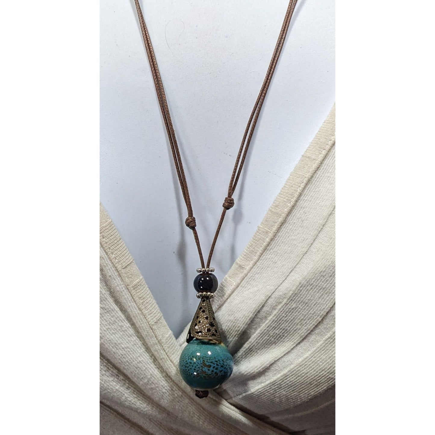 Bohemian Fantasy Blue Ceramic Pendant Necklace On Brown Cord