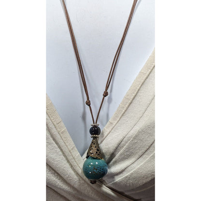 Bohemian Fantasy Blue Ceramic Pendant Necklace On Brown Cord