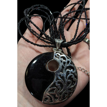 Floral Overlay Black And Silver Tone Pendant Necklace With Black Glass Beads