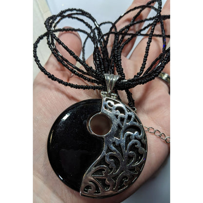 Floral Overlay Black And Silver Tone Pendant Necklace With Black Glass Beads