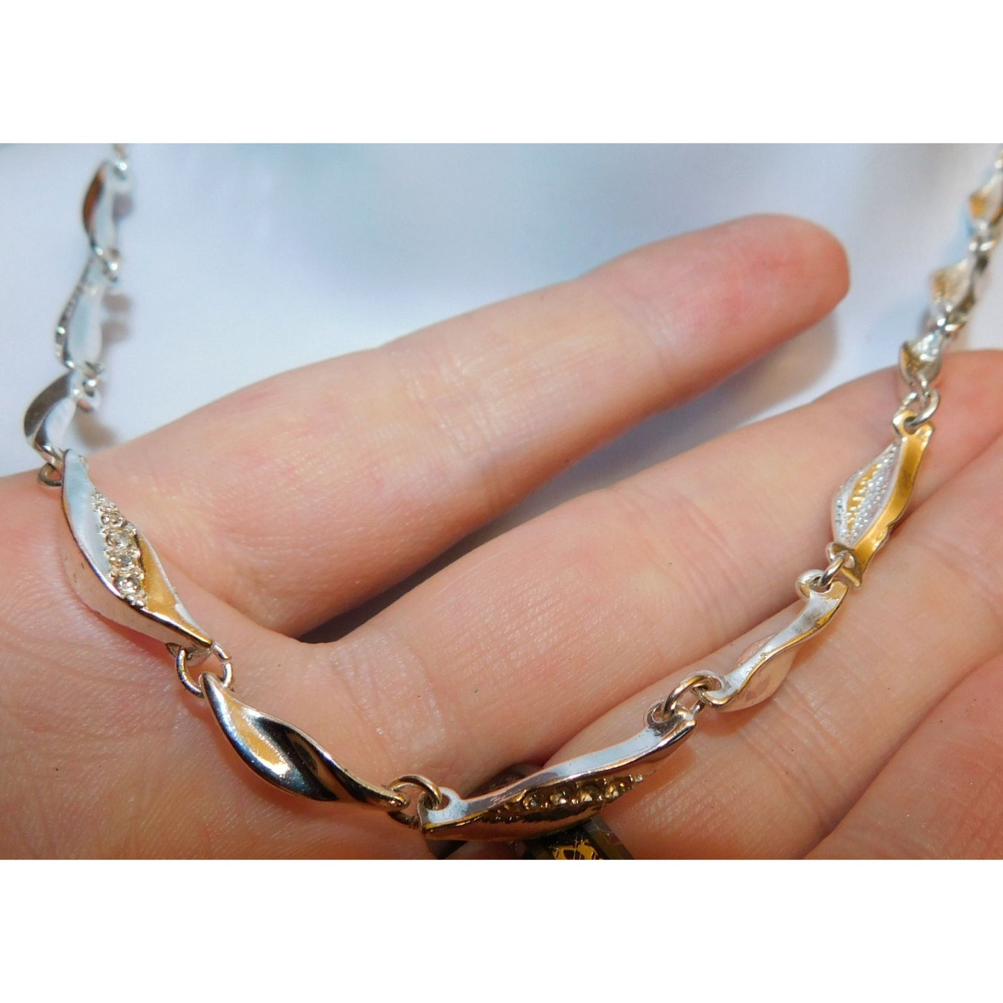 Rhinestone Twisted Leaf Link Necklace With Rhinestone Accents And Pearl Back